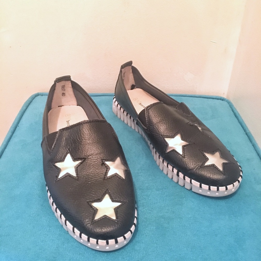 Black pleather slip on shoes with metallic stars